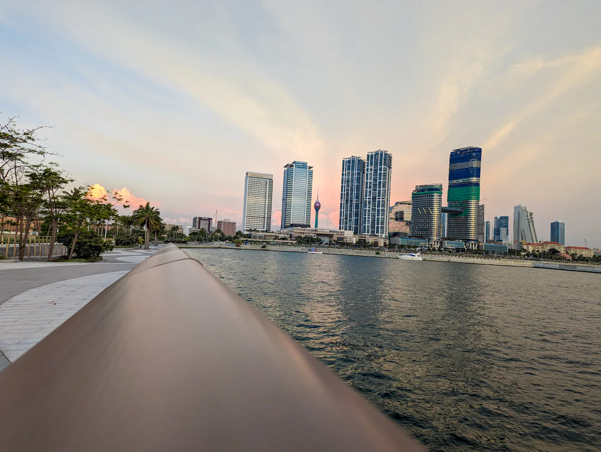 The Colombo waterfront at dusk, with the Lotus Tower and the Port City towers on the skyline